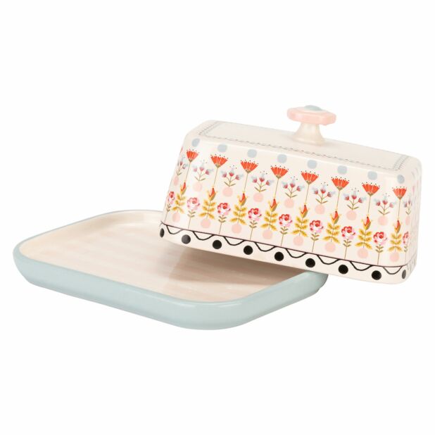 Block butter is best served on its very own dish! This painted table covered butter dish from Cath K